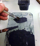 Painting excess enamel onto the palette